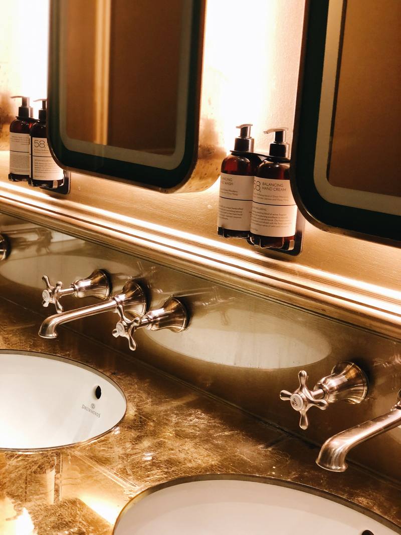 Basins with traditional cross-head taps in a London bathroom